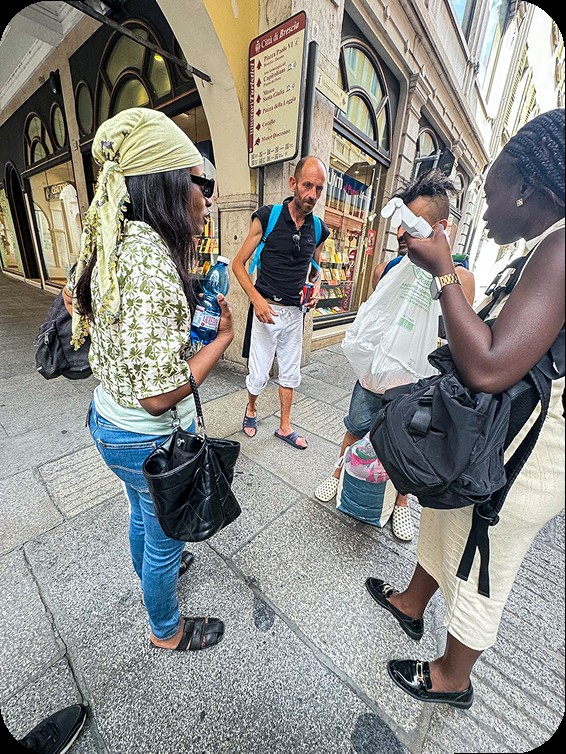 Born to Love volunteers talking with people in Brescia